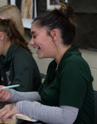 Girl laughing in class